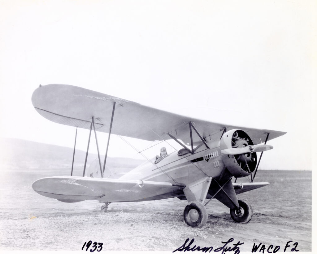 Sherman Lutz in biplane